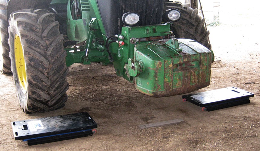 weighing the front and back of the tractor