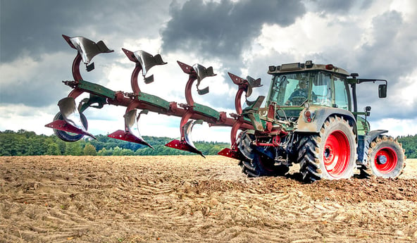 What is the impact of implement settings on tractor tyres?